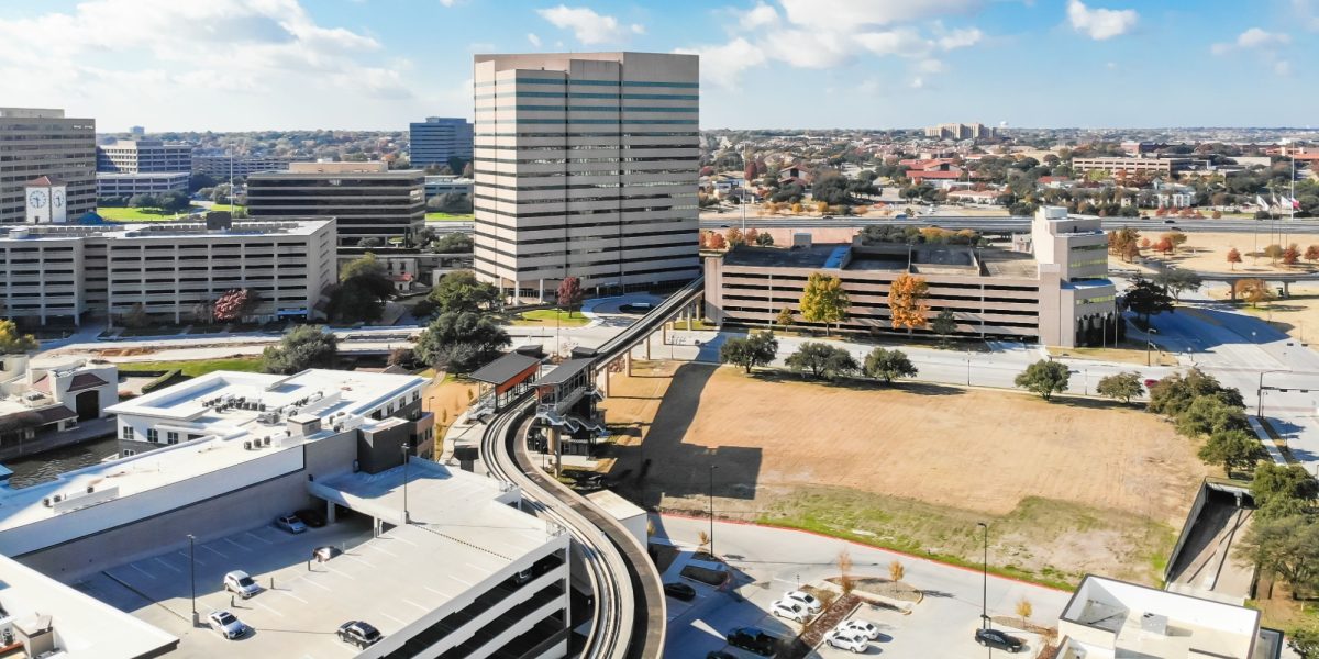 Panorama aerial view downtown Las Colinas, Irving, Texas and light rail system (Area Personal Transit, APT). Las Colinas is an upscale, developed area in the Dallas suburb