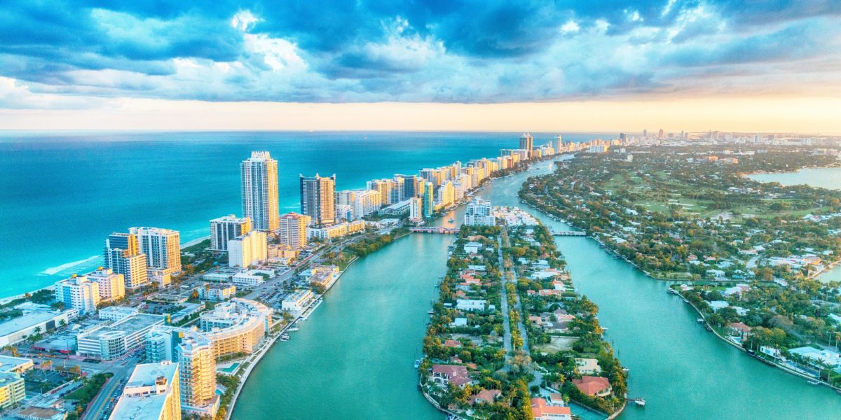 Miami Beach, wonderful aerial view of buildings, river and vegetation.