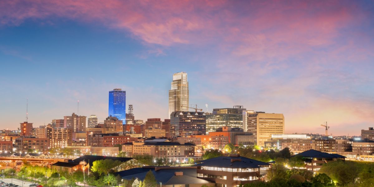 Omaha, Nebraska, USA downtown cityscape at dusk.