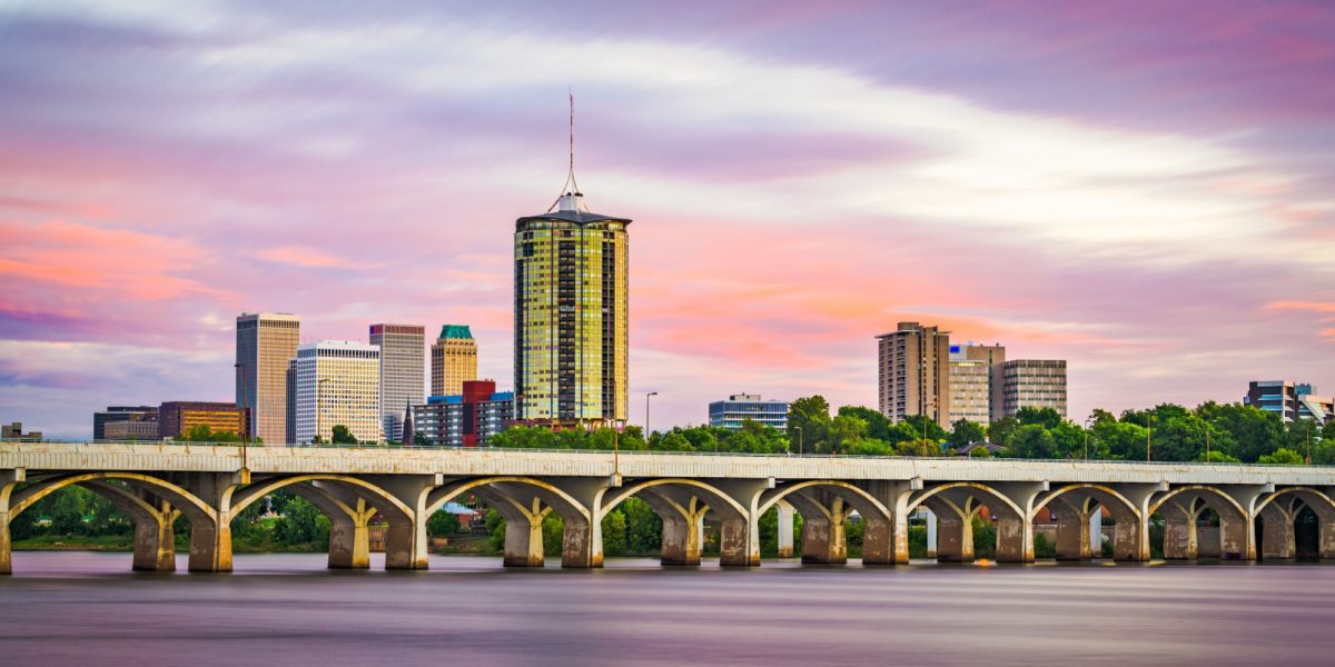 Tulsa, Oklahoma, USA downtown skyline on the Arkansas River at dusk.