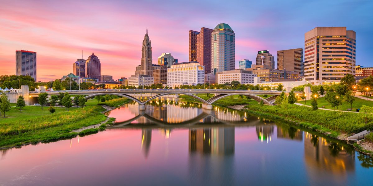 Columbus, Ohio, USA skyline on the river at dusk.